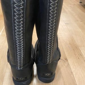 Tall black UGG boots with Tasman pattern